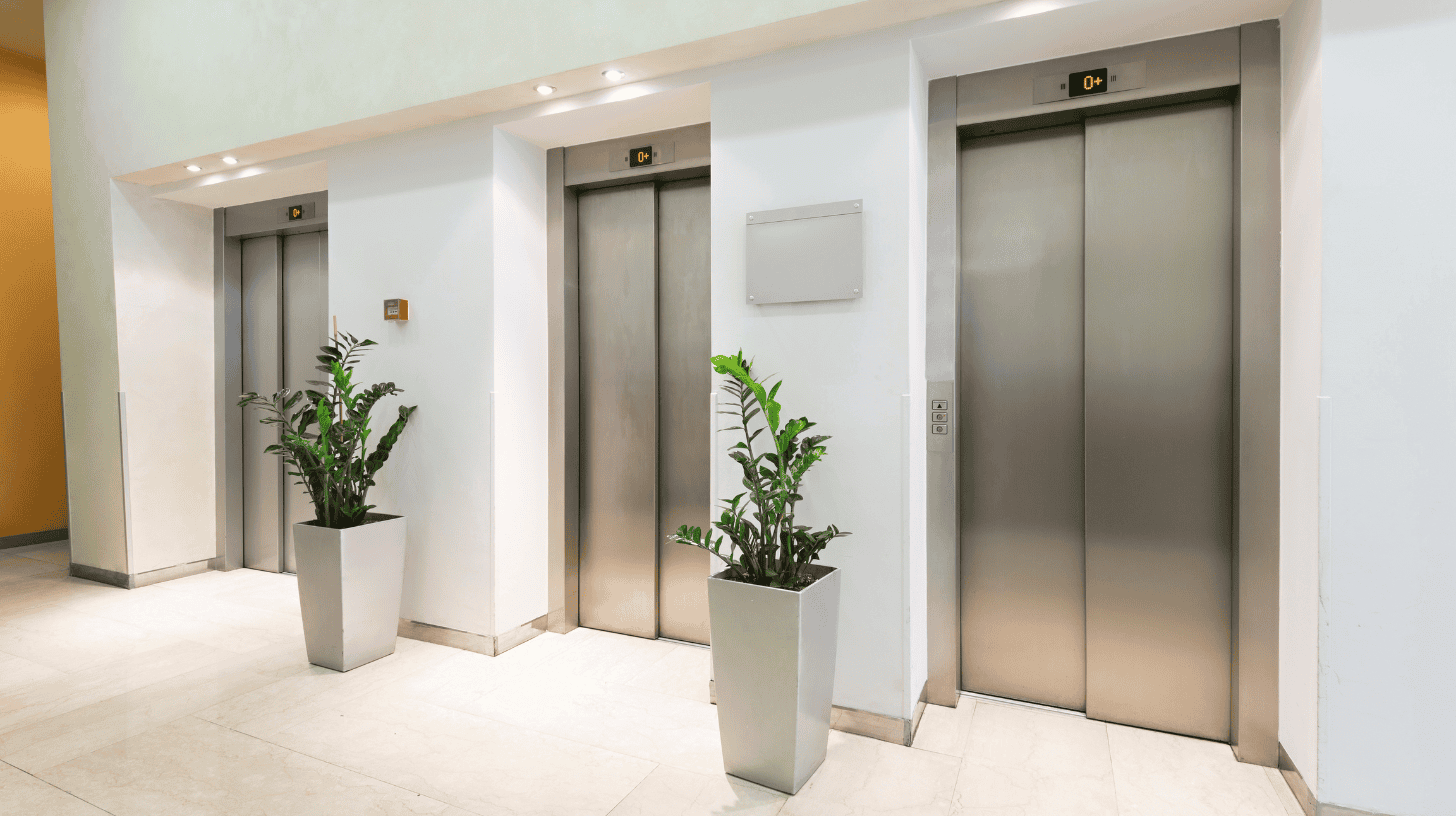 Three sets of elevators at a corporate office.