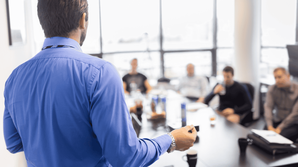 Chief Operating Officer presenting strategy in an executive meeting.