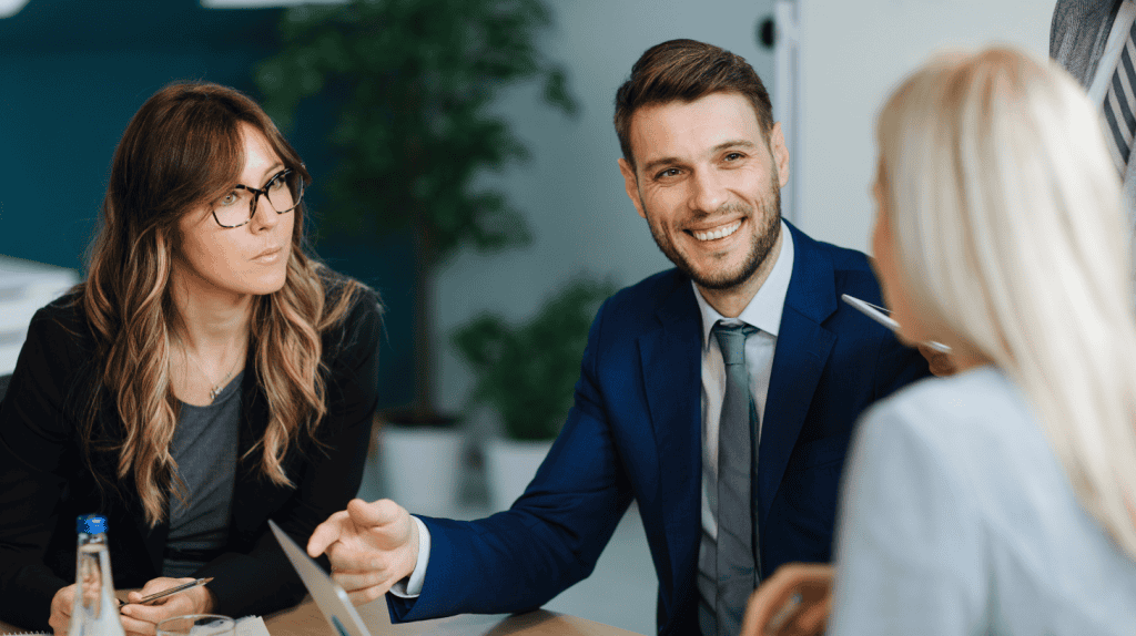 Business professionals in a meeting, collaborating on CHRO profile development and HR leadership strategies.