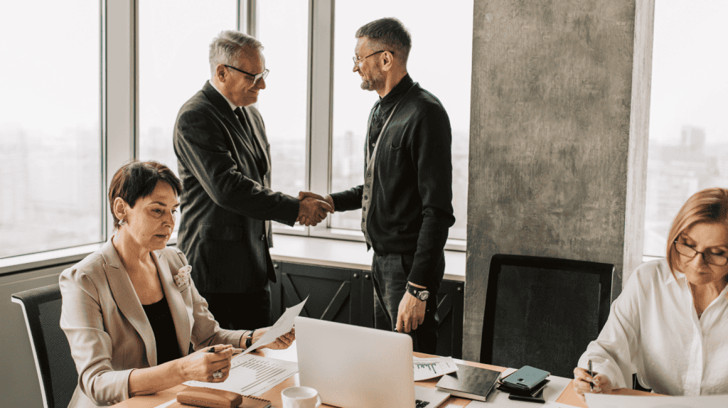 Board members and executives meeting to discuss succession planning, executive succession planning, and leadership continuity as part of board governance.