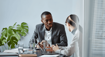 Executive coaching session in a modern office setting.