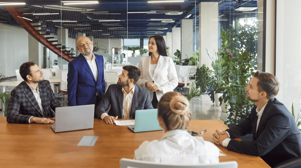 Corporate affairs leaders discussing geopolitical risk management and policy strategy in a leadership meeting.