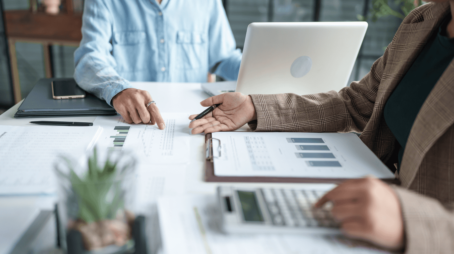 Chief Revenue Officer reviewing revenue performance data with team, illustrating CRO leadership and revenue growth strategy.