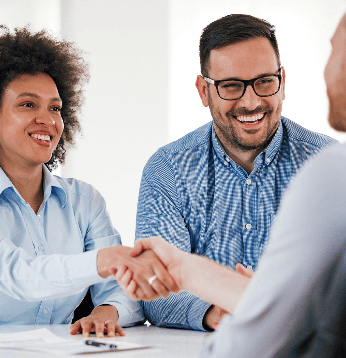 Chief Human Resources Officer and HR leadership shake hands with a potential candidate.