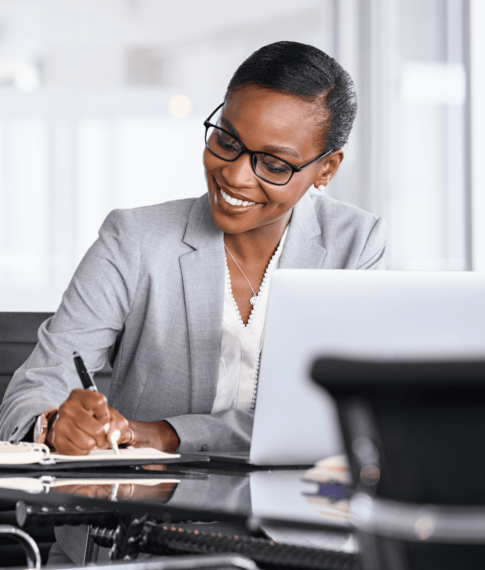 Chief Legal Officer takes notes during a meeting.