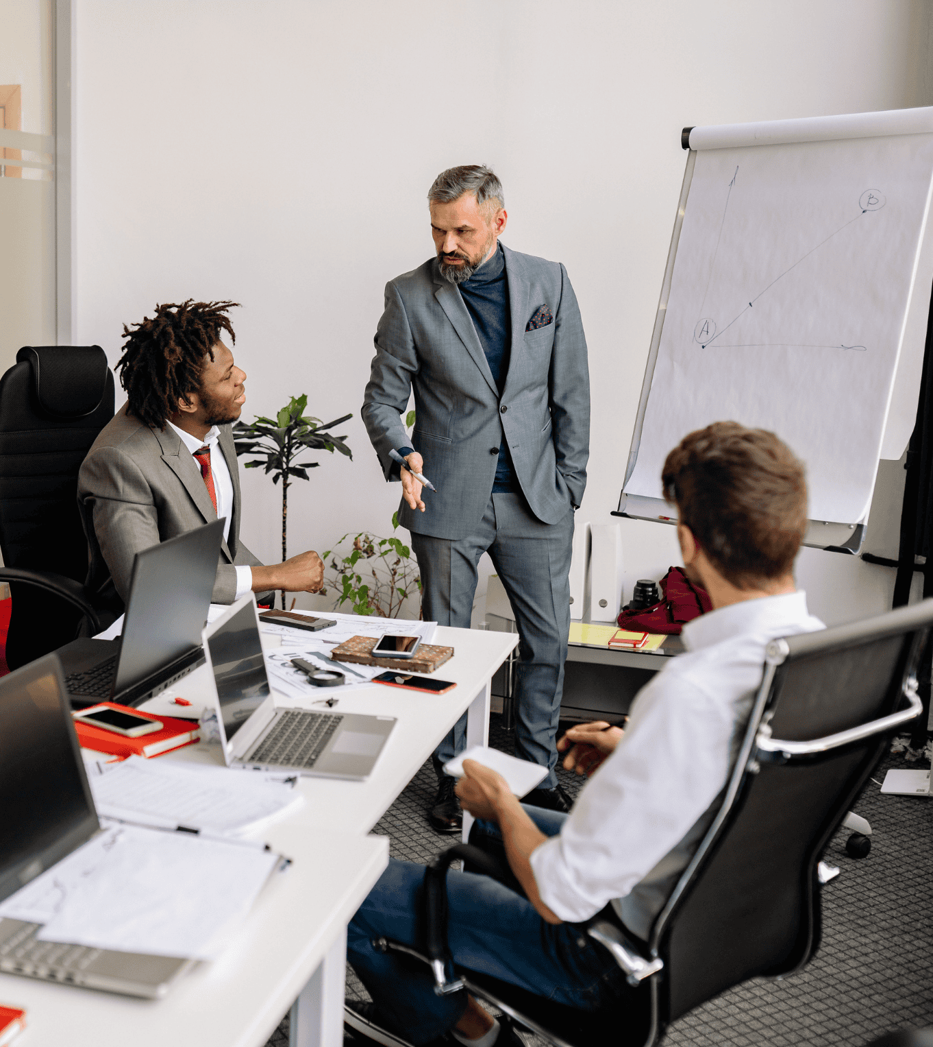 Chief Legal Officer meets with team in conference room.