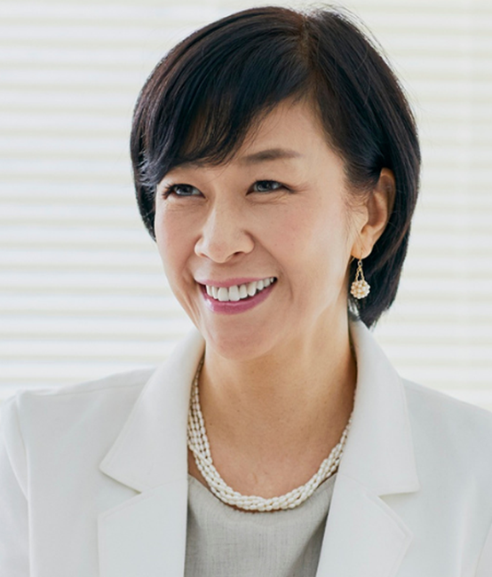 Chief Supply Chain Officer smiling in a meeting.