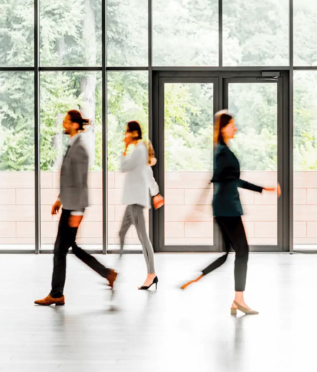 Human resources executives walk through the office.