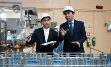 Chief Product Officer walking a manufacturing floor with a plant manager, reviewing operational strategy firsthand.