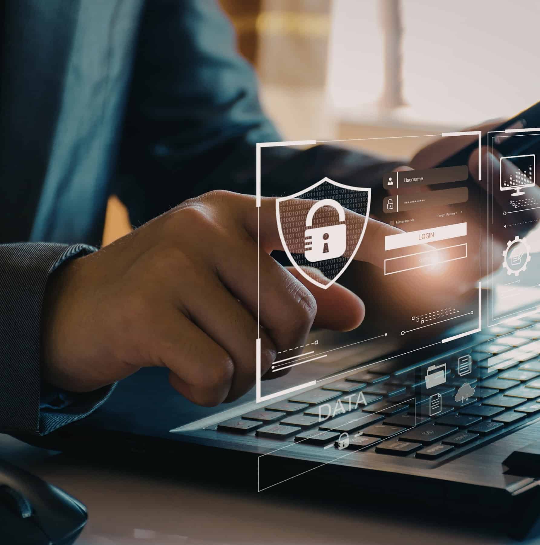 Interfaz de seguridad digital que muestra un candado y una pantalla de inicio de sesión sobre el teclado de un portátil en el sector de la ciberseguridad y la seguridad informática (CISO).