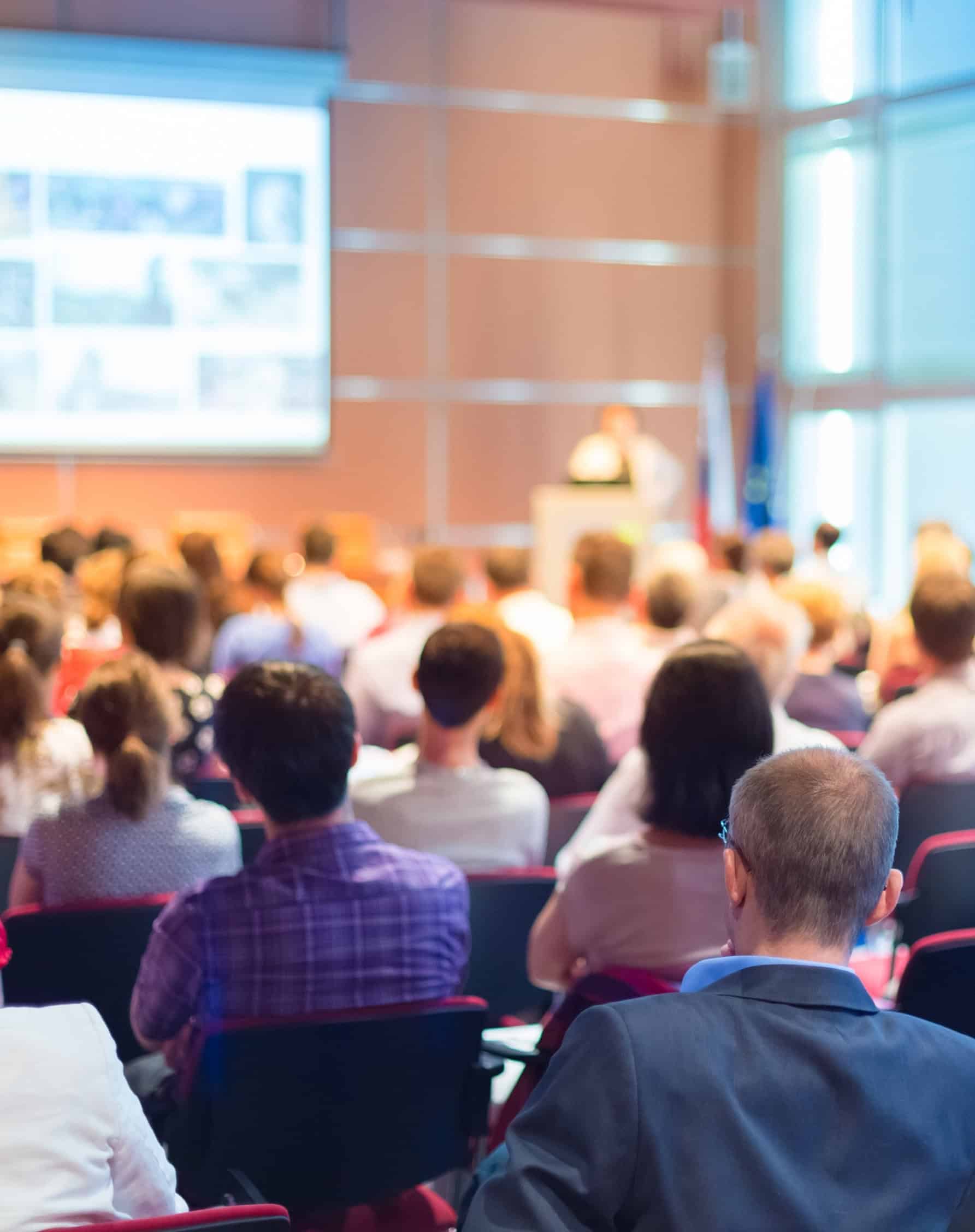 Audience attending a trade association executive presentation in the trade association industry.