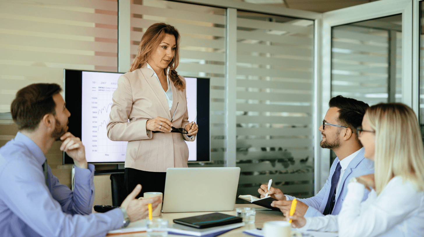 A Chief Information Officer presents findings to her team.